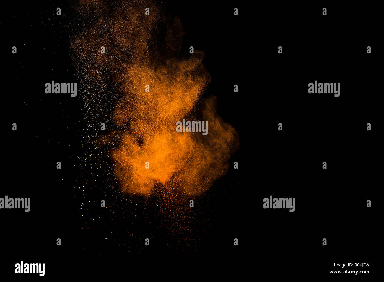 Abstract orange paint Holi. Abstract orange powder explosion on black ...