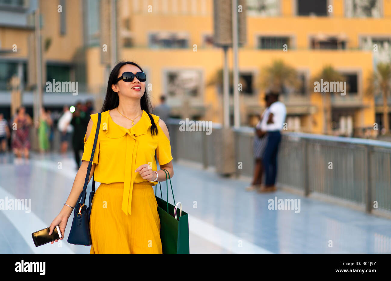 Happy tourist walking around the Dubai mall Stock Photo