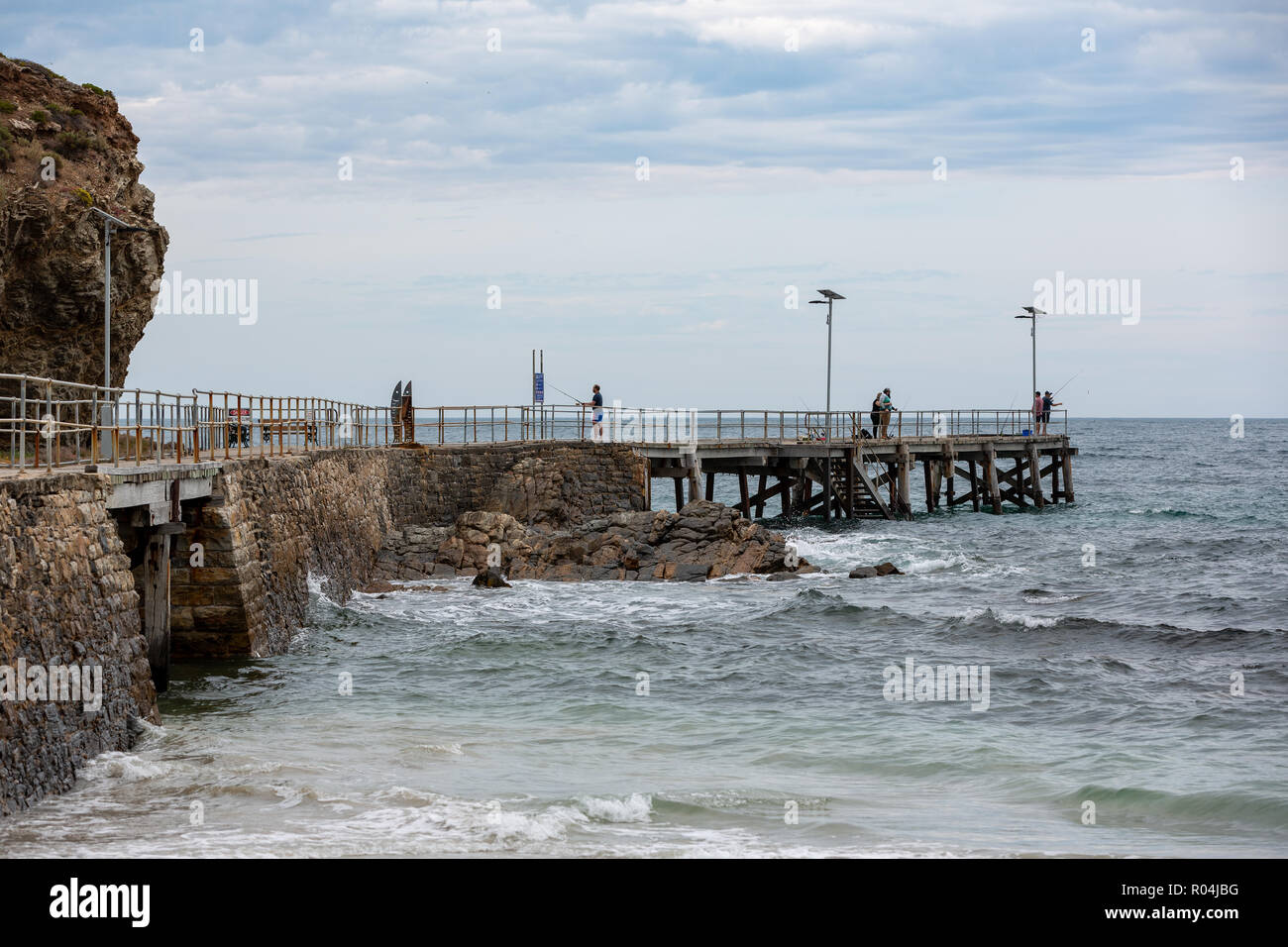 People fishing on the iconic Second Valley jetty on an overcast day on