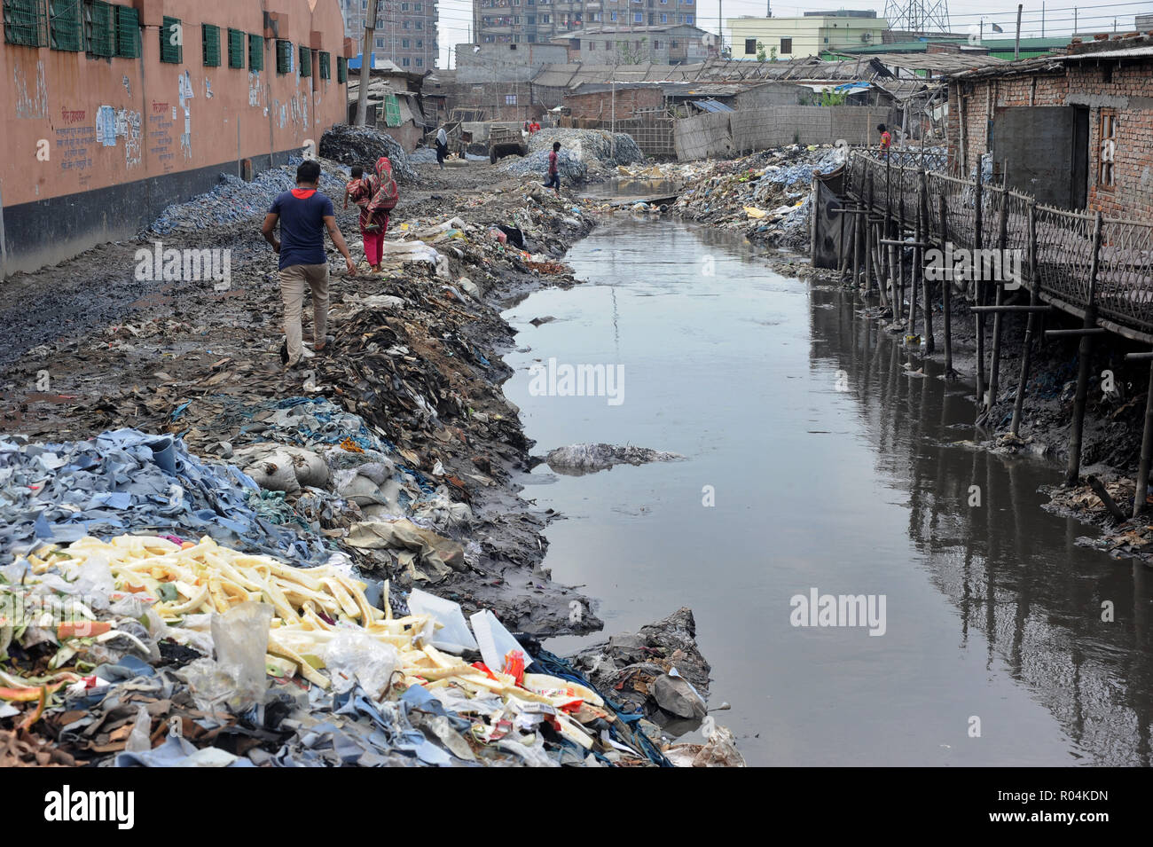 Dhaka, Bangladesh - April 04, 2016: Wastage toxic lather materials dumped in an open canal at the Hazaribagh tannery area in Dhaka, Bangladesh. Stock Photo