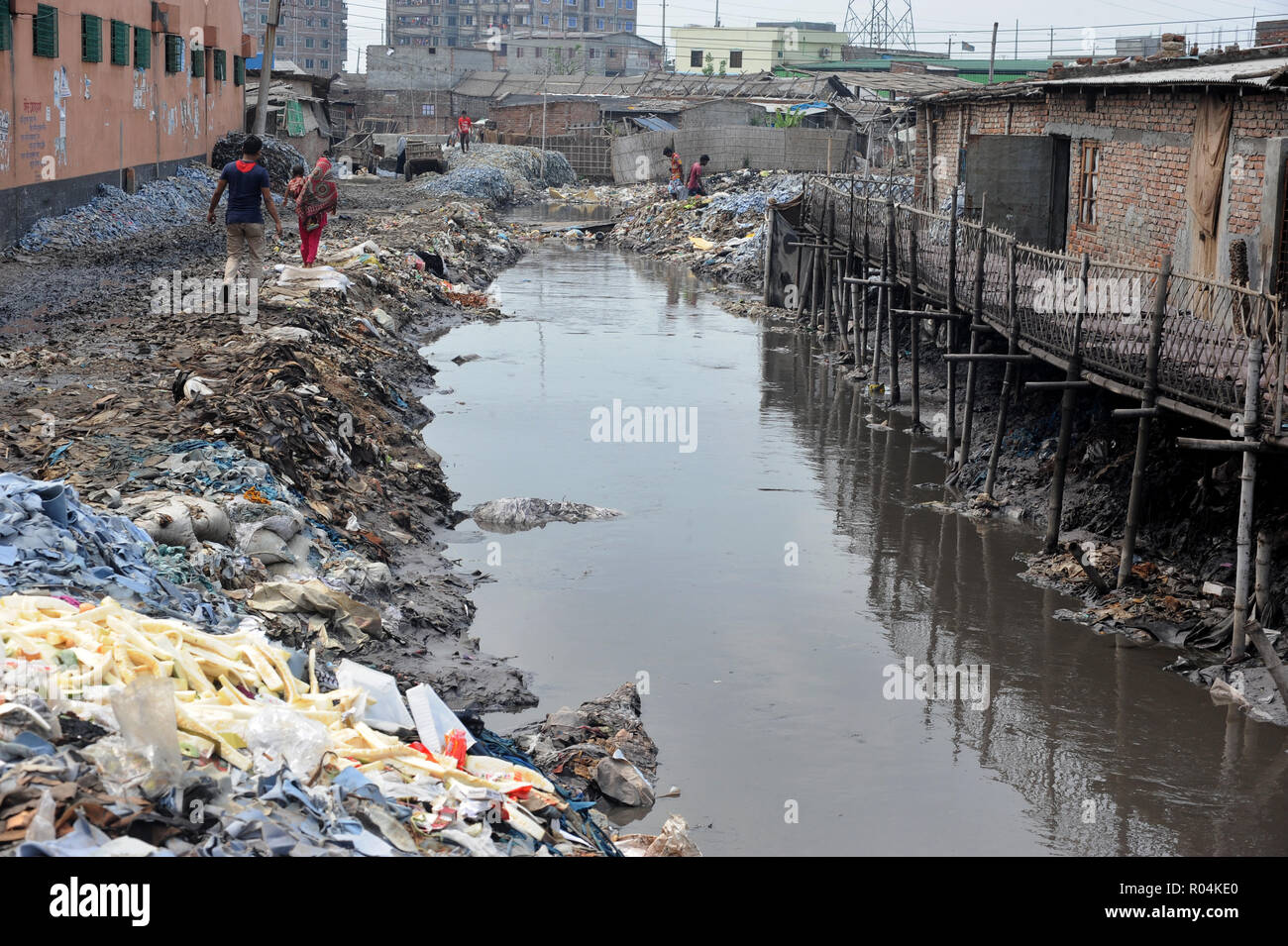 Dhaka, Bangladesh - April 04, 2016: Wastage toxic lather materials dumped in an open canal at the Hazaribagh tannery area in Dhaka, Bangladesh. Stock Photo