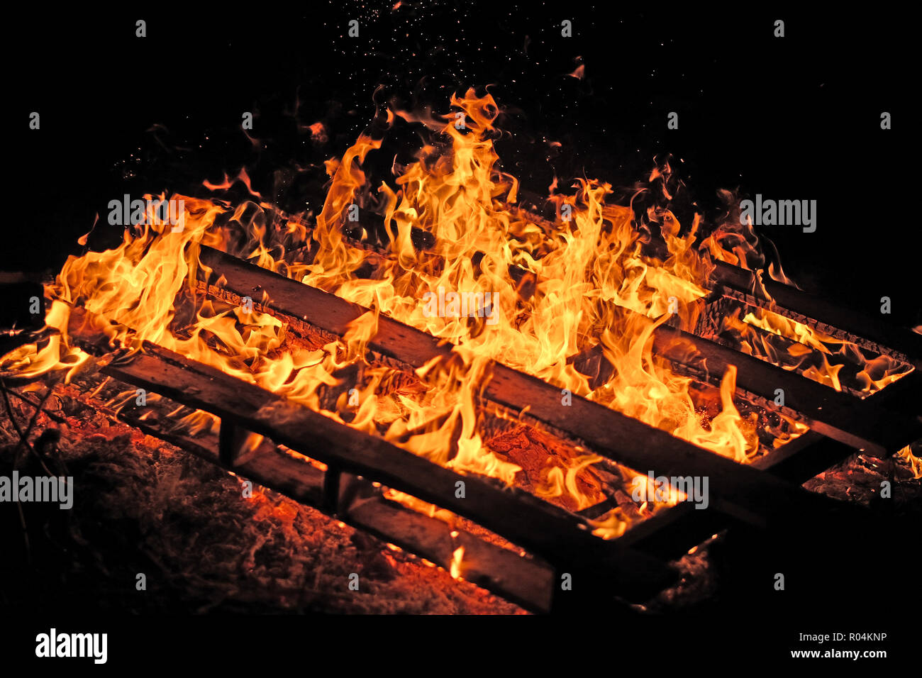Burning pallets on a bonfire. Stock Photo
