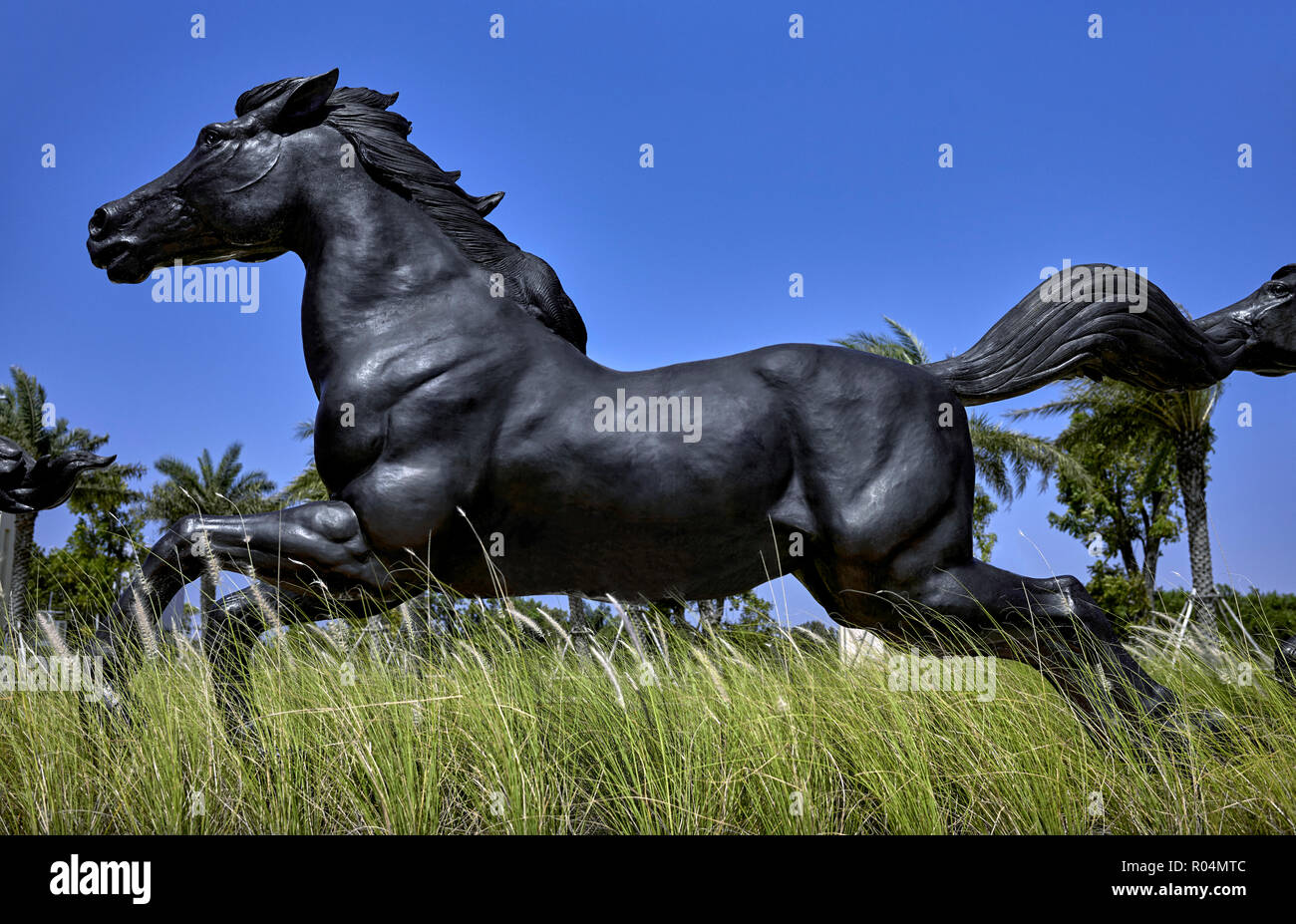 Horse running. Statue of a black stallion in full flight. Stock Photo