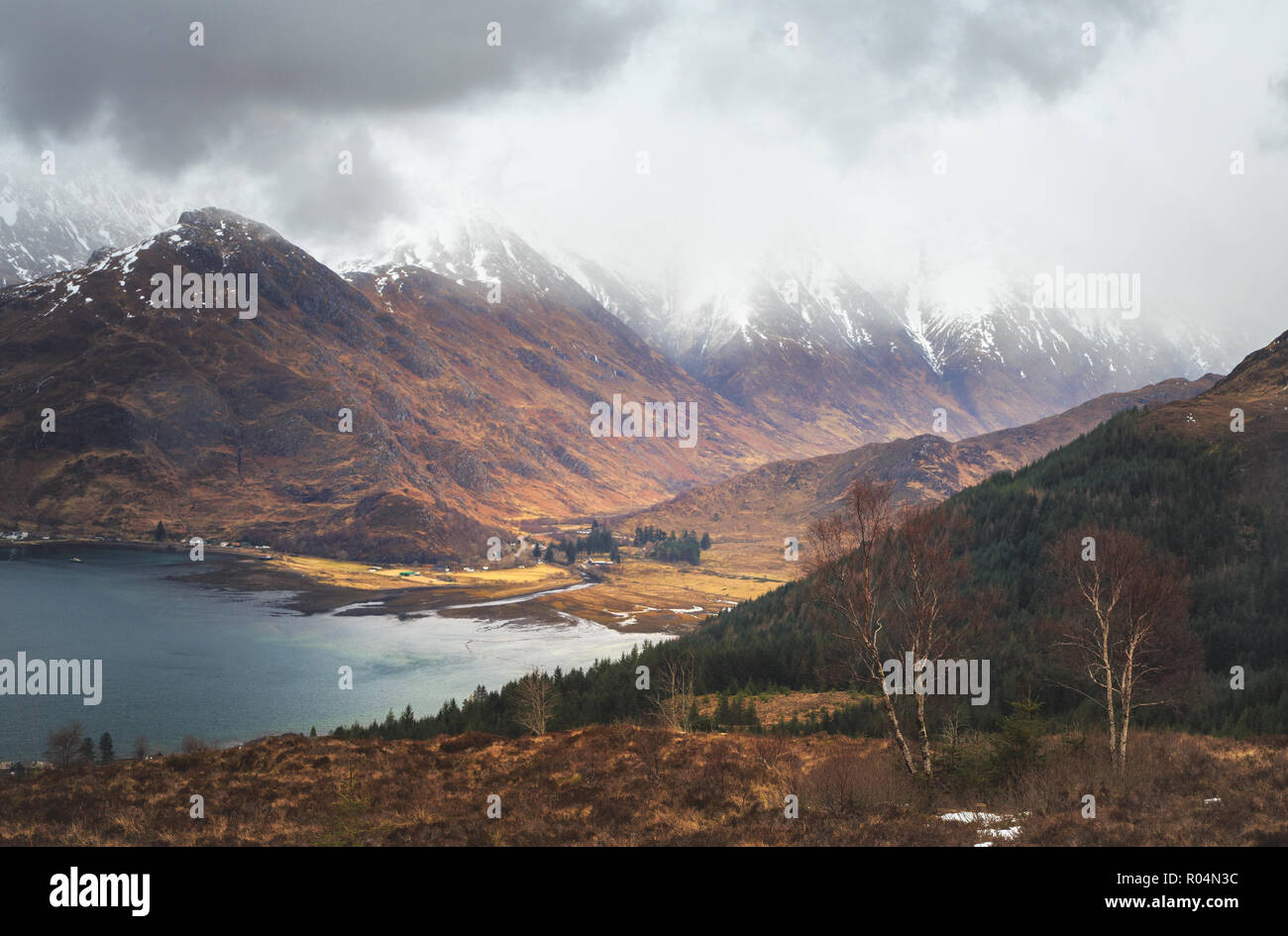 Clouds cover on the tops of Five Sisters of Kintail mountains, Loch Duich area, scottish Highlands. Stock Photo