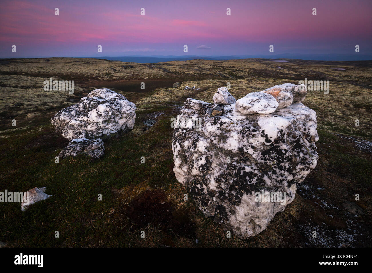 Big quartz rocks on the top of a mountain in Nordgruvefeltet area - old mining grounds in middle Norway. Summer night time. Stock Photo