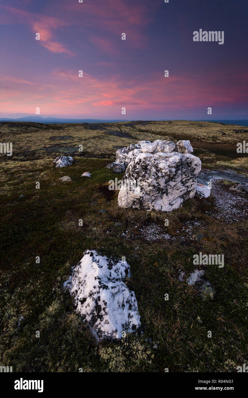 Big quartz rocks on the top of a mountain in Nordgruvefeltet area - old mining grounds in middle Norway. Summer night time. Stock Photo