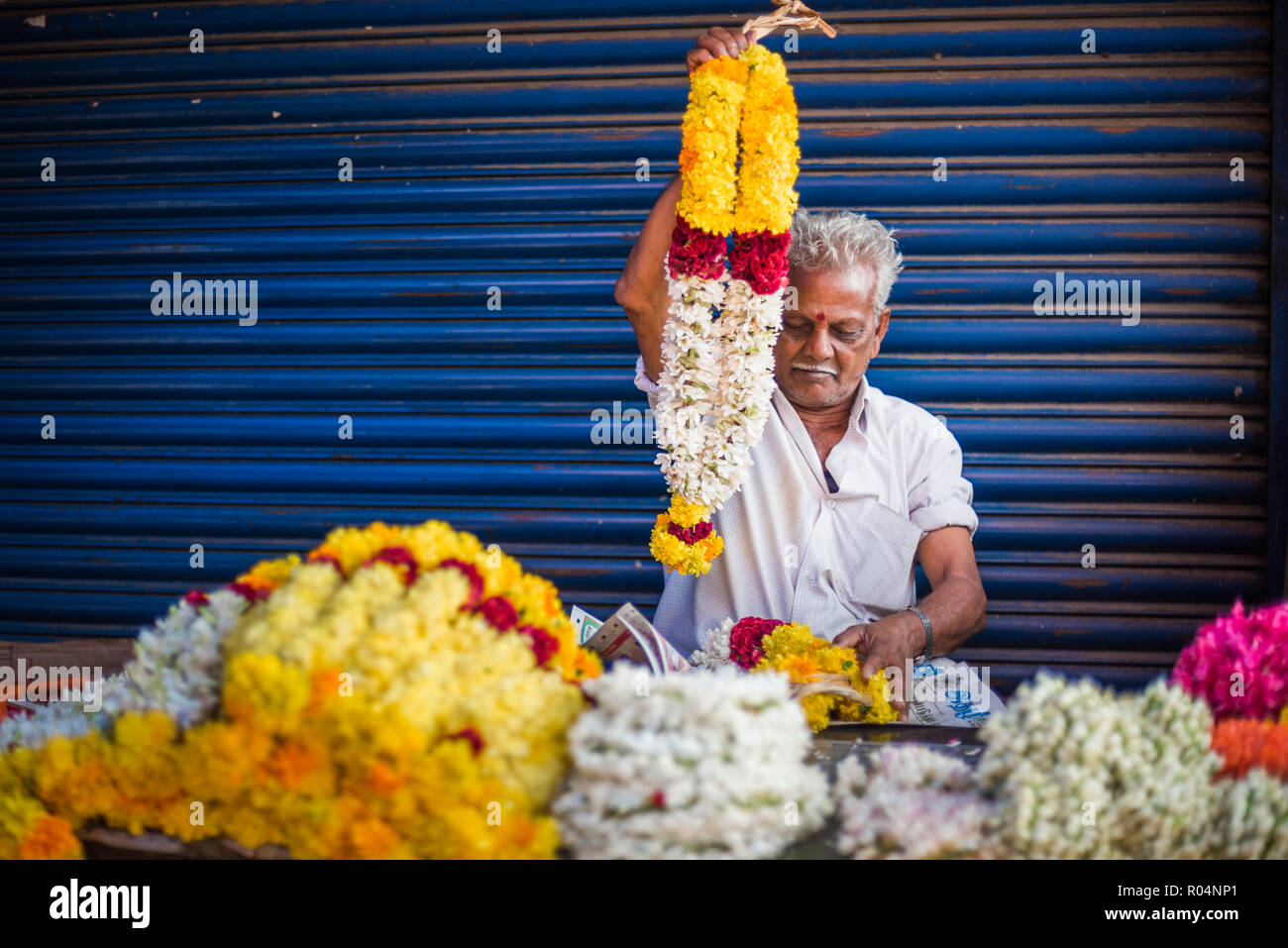 Selling flowers by a temple at at market in Munnar, Western Ghats Mountains, Kerala, India, Asia Stock Photo
