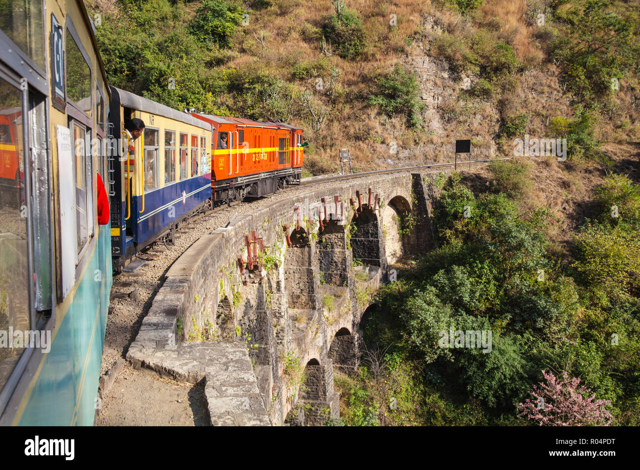 The Himalayan Queen toy train crossing a viaduct, on the Kalka to Shimla Railway, UNESCO World Heritage Site, Northwest India, Asia Stock Photo