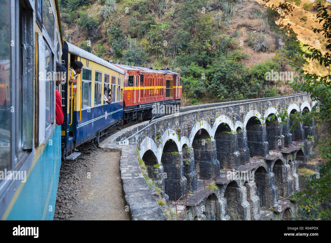 The Himalayan Queen toy train crossing a viaduct, on the Kalka to Shimla Railway, UNESCO World Heritage Site, Northwest India, Asia Stock Photo