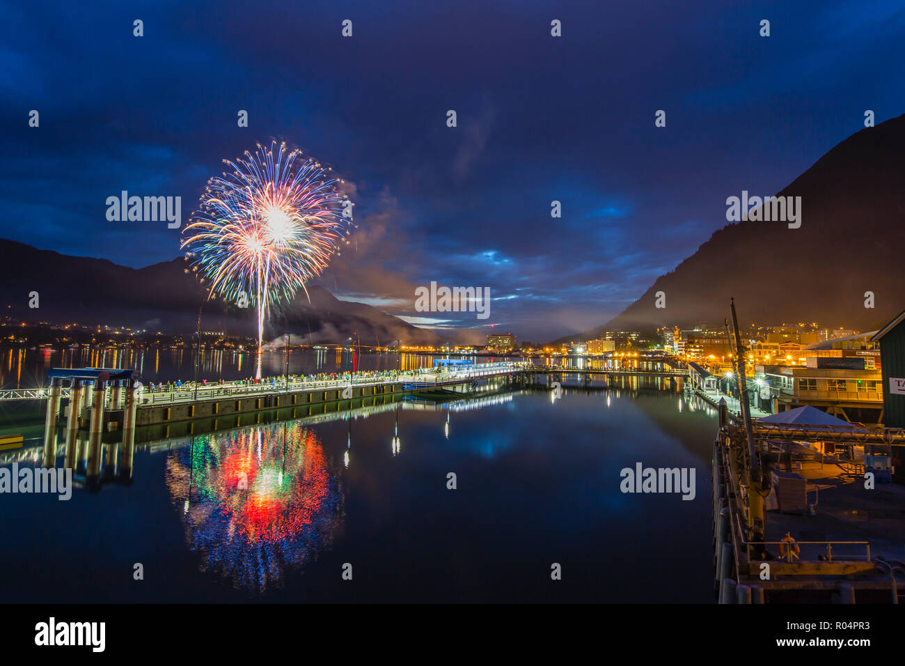 July 4th fireworks from downtown in the harbor of Juneau, Southeast Alaska, United States of America, North America Stock Photo