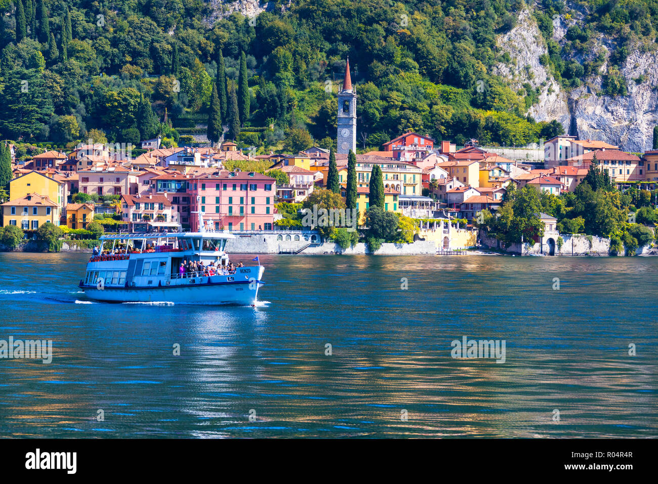 People on boat trip around the village of Varenna, Lake Como, Lecco province, Lombardy, Italian Lakes, Italy, Europe Stock Photo