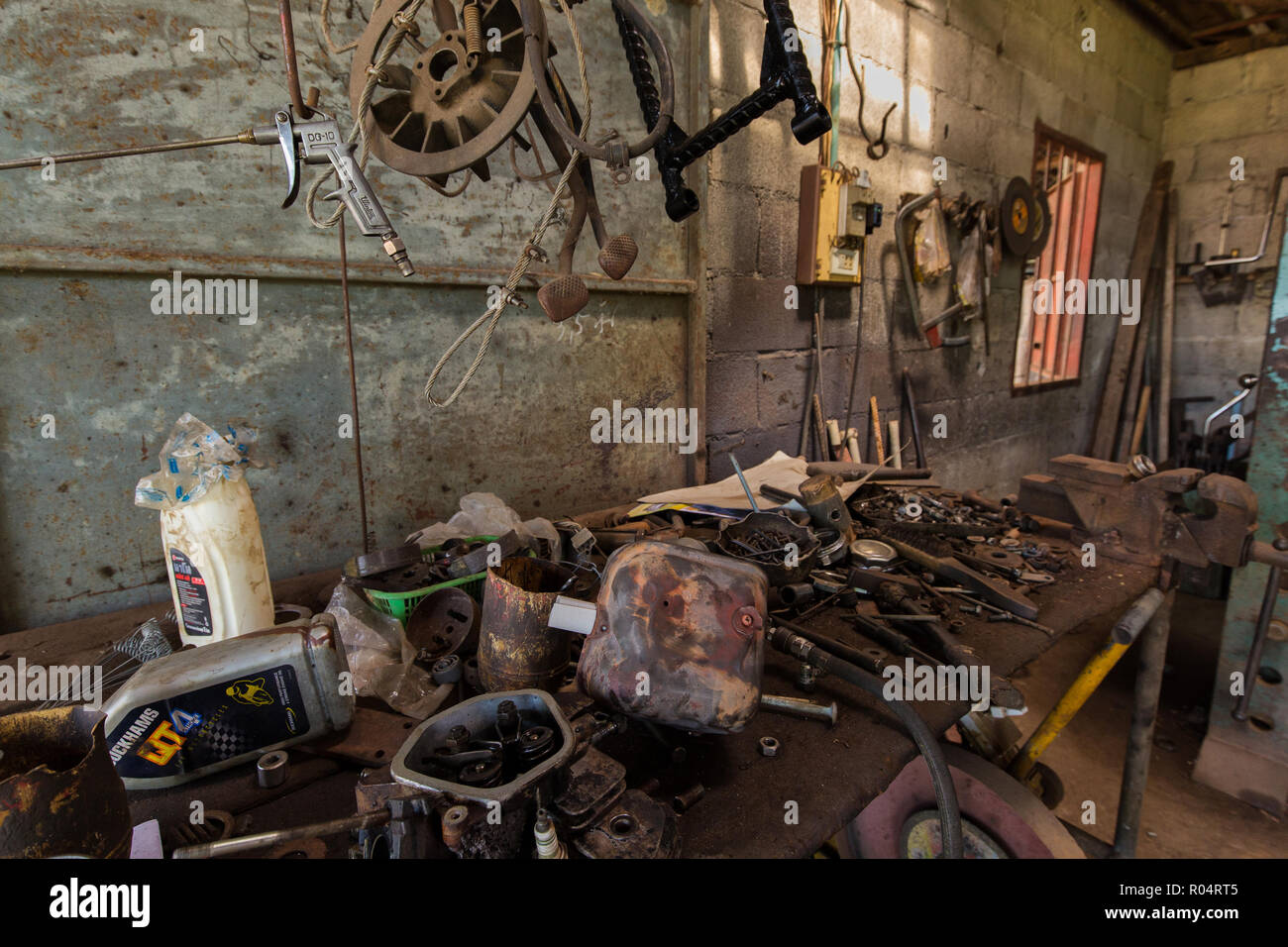 Tools and vehicles parts in a mechanical turner Stock Photo