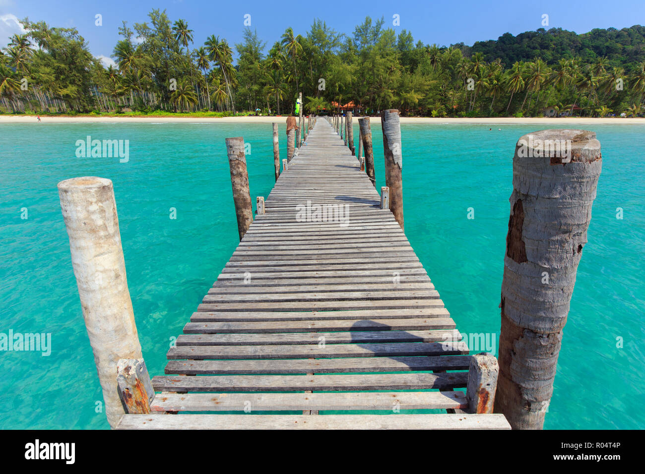 Wooden pontoon in the turquoise tropical sea of Bang Bao Bay in Ko Kood island, Thailand . Stock Photo