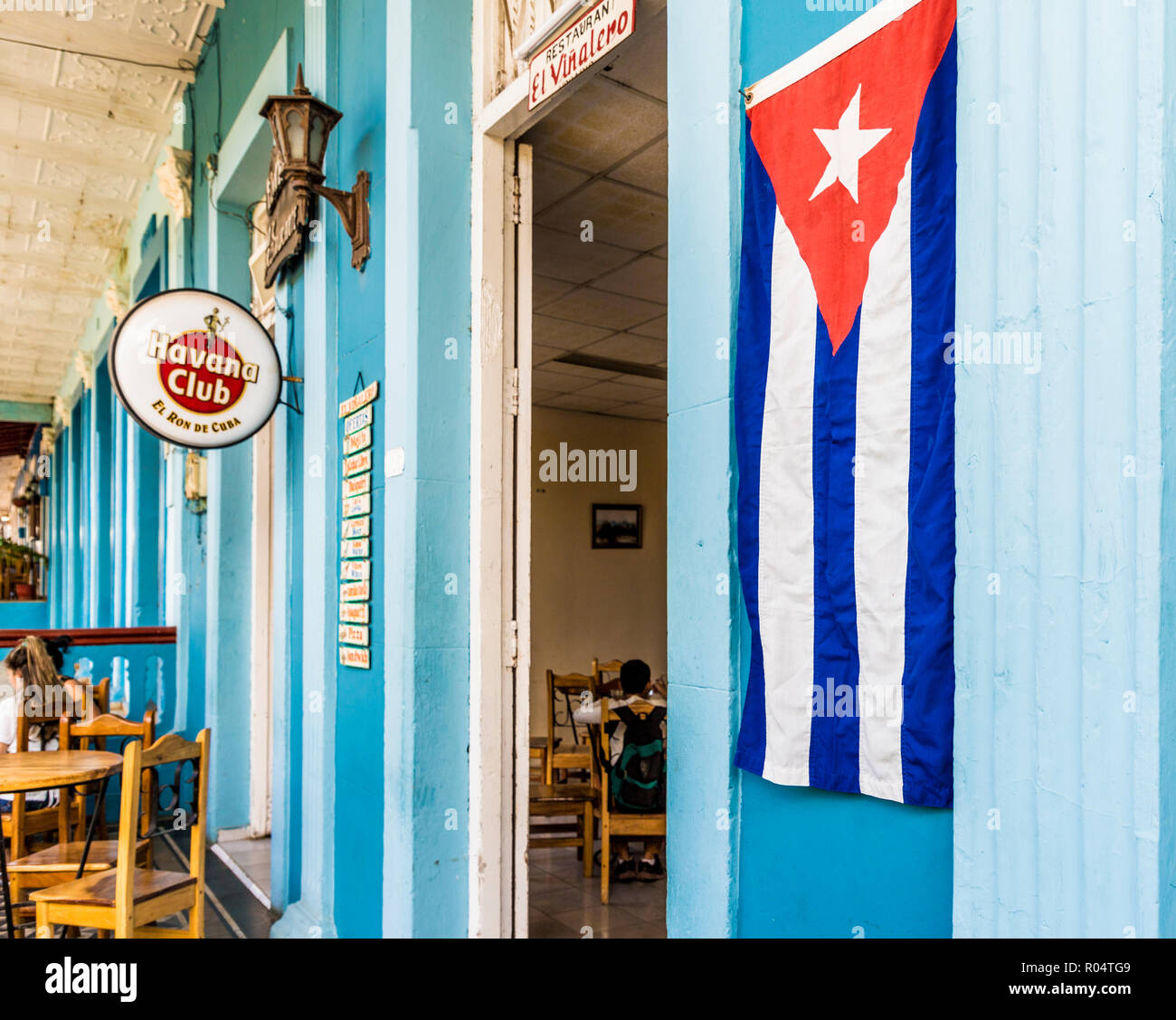 A Cuban flag outside a restaurant in Vinales town, Vinales, Pinar del Rio, Cuba, West Indies, Caribbean, Central America Stock Photo