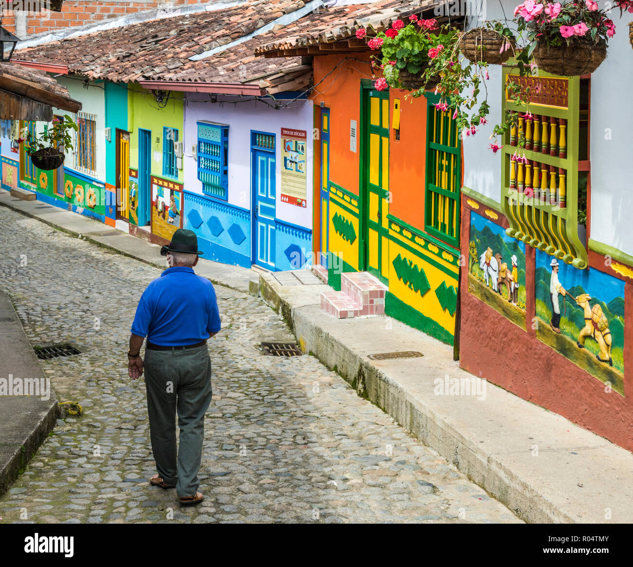 A typically colourful street with buildings covered in traditional local tiles in the picturesque town of Guatape, Colombia, South America Stock Photo