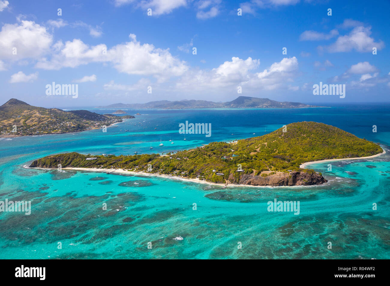 Aerial view of Petit St. Vincent, with Petite Martinique to the left and Carriacou, Grenada in the distance, St. Vincent and The Grenadines Stock Photo