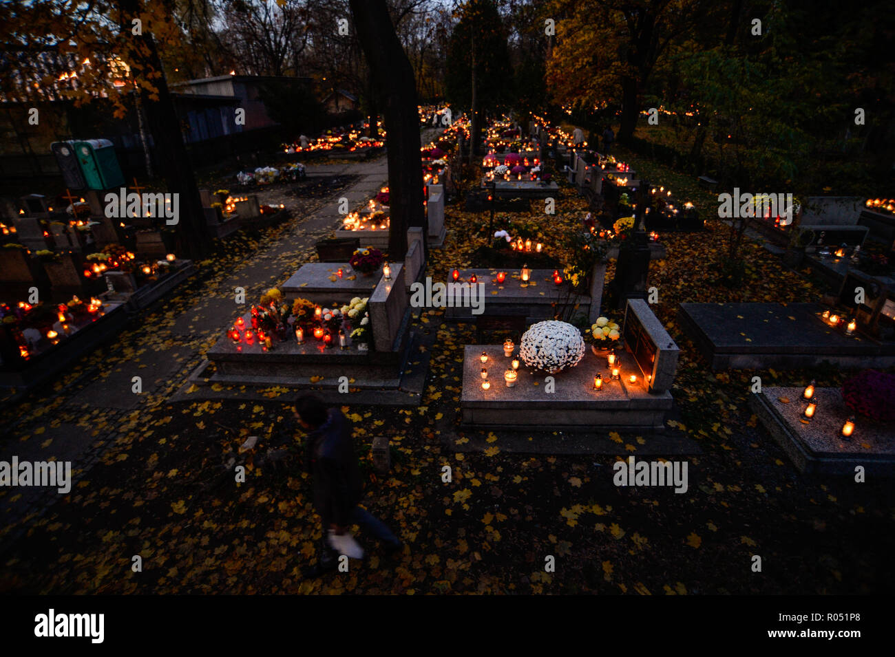 Krakow, Poland. 1st Nov, 2018. Graves with candles lighting are seen at the Rakowicki Cemetery during the celebrations.All Saints Day, also known as The Day of the Dead, is a Roman Catholic day of remembrance of friends and loved ones who have passed away. Credit: Omar Marques/SOPA Images/ZUMA Wire/Alamy Live News Stock Photo