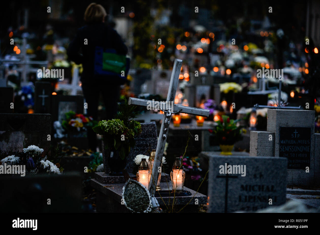 Krakow, Poland. 1st Nov, 2018. Candles are seen lighting on top of the graves at the Rakowicki Cemetery during the celebrations.All Saints Day, also known as The Day of the Dead, is a Roman Catholic day of remembrance of friends and loved ones who have passed away. Credit: Omar Marques/SOPA Images/ZUMA Wire/Alamy Live News Stock Photo