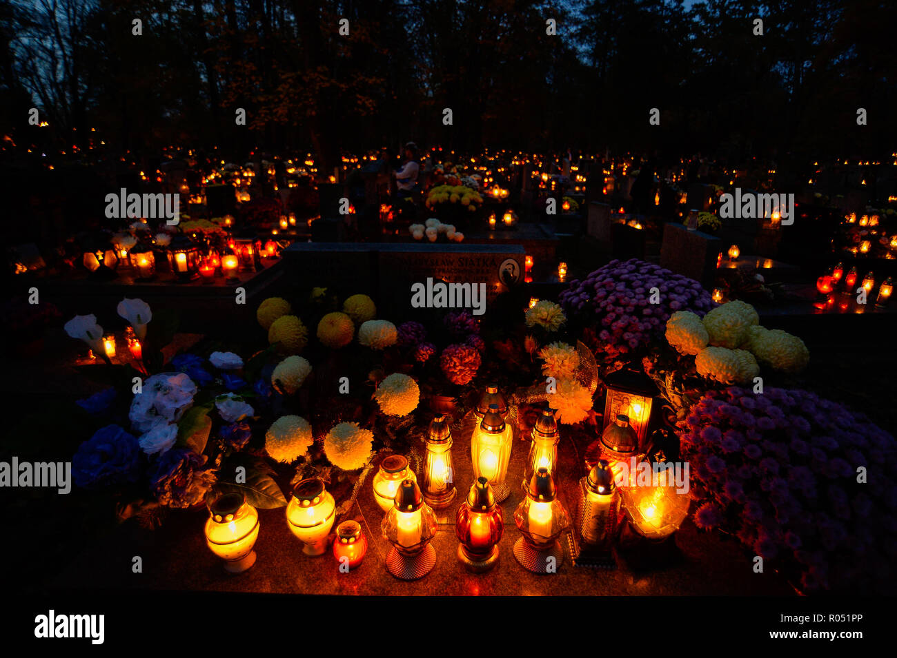 Krakow, Poland. 1st Nov, 2018. Graves with candles lighting are seen at the Rakowicki Cemetery during the celebrations.All Saints Day, also known as The Day of the Dead, is a Roman Catholic day of remembrance of friends and loved ones who have passed away. Credit: Omar Marques/SOPA Images/ZUMA Wire/Alamy Live News Stock Photo