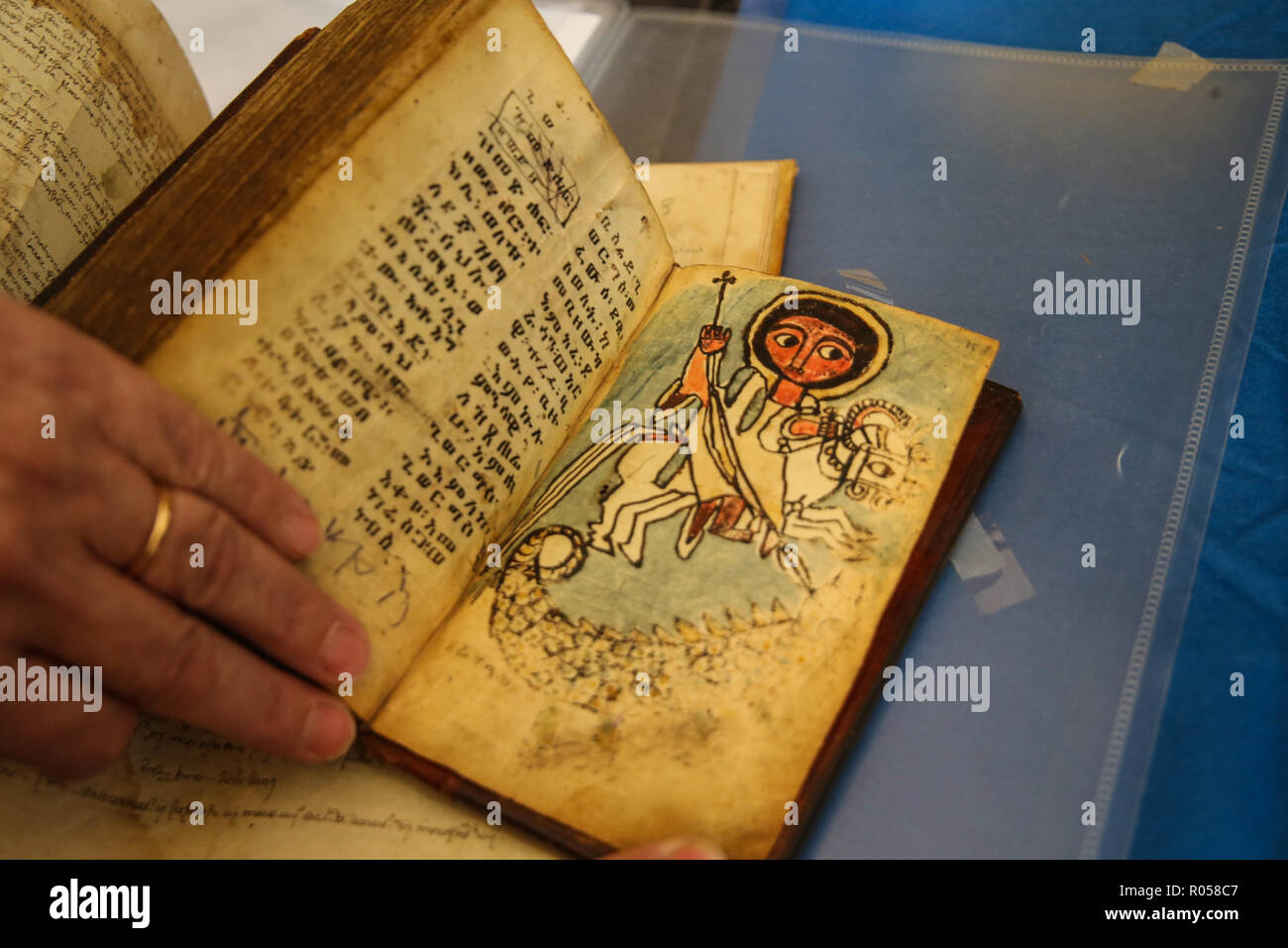London UK 02 November 2018 The ABA (Antiquarian Book Association) Chelsea Rare Book Fair at the Chelsea Old Town Hall for the 28th edition With more than 80 exhibitors specializing in all type of books, manuscripts, maps, prints, and ephemera, with some fantastic offers like these Ethiopian books depicting the archangel Gabriel with the soils of the dead in his wings and the St George killing the dragon @Paul Quezada-Neiman/Alamy Live News Stock Photo