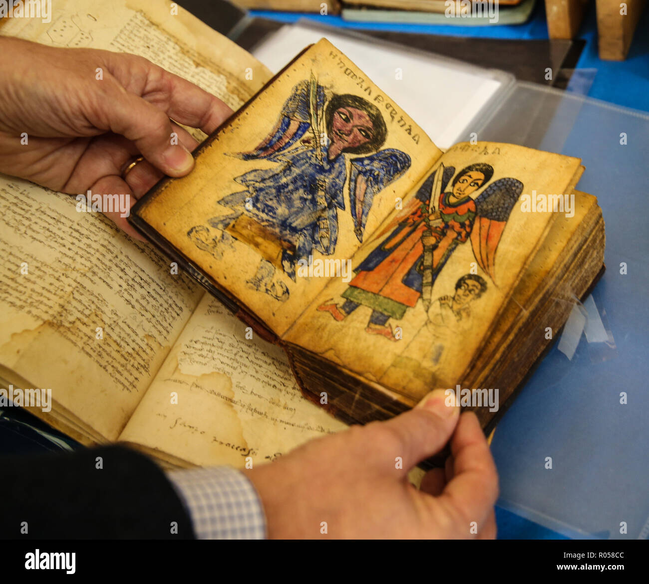 London UK 02 November 2018 The ABA (Antiquarian Book Association) Chelsea Rare Book Fair at the Chelsea Old Town Hall for the 28th edition With more than 80 exhibitors specializing in all type of books, manuscripts, maps, prints, and ephemera, with some fantastic offers like these Ethiopian books depicting the archangel Gabriel with the soils of the dead in his wings and the St George killing the dragon @Paul Quezada-Neiman/Alamy Live News Stock Photo