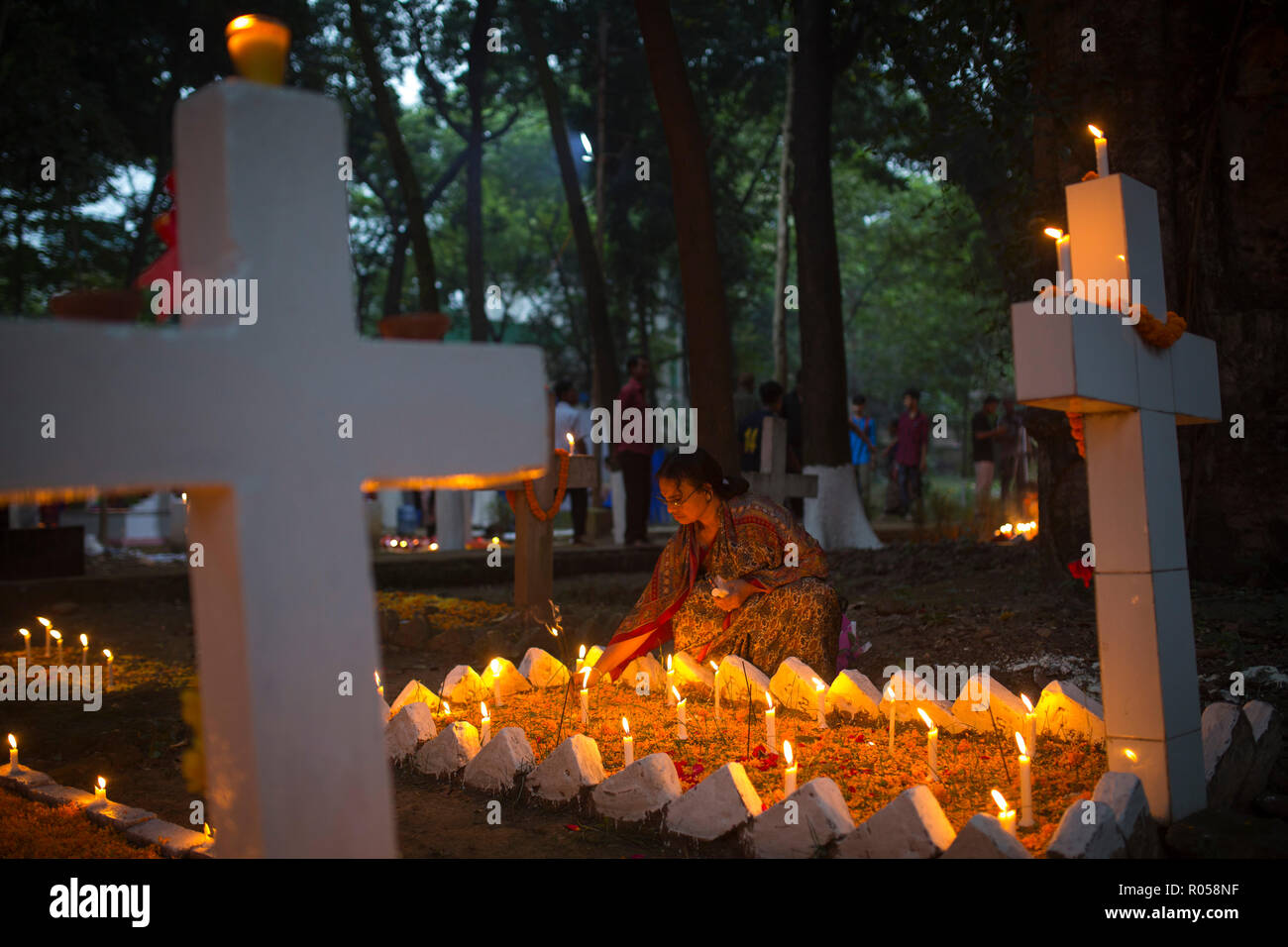 Dhaka, Bangladesh. 2nd Nov 2018.  Christian devotees observe All Souls' Day, known as the Feast of All Souls, Commemoration of all the Faithful Departed in Dhaka , Bangladesh on November 02, 2018.  On this day, Christians come to the graveyard and pray for the departed souls of their loved ones..All Soul's Day is a Roman Catholic day of remembrance for friends and loved ones who have passed away. Credit: zakir hossain chowdhury zakir/Alamy Live News Stock Photo