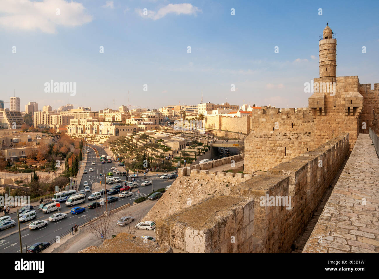 JERUSALEM - JAN 24, 2011: View from the old city wall of Jerusalem on the Tower of David and traffic around the city centre. Stock Photo