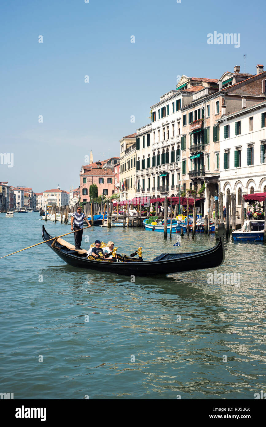 Gondola and tourists on the Grand Canal in Venice, Italy Stock Photo ...