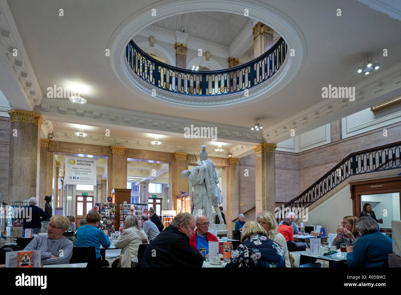 Customers having tea and cake at the cafe in the lobby of the Walker