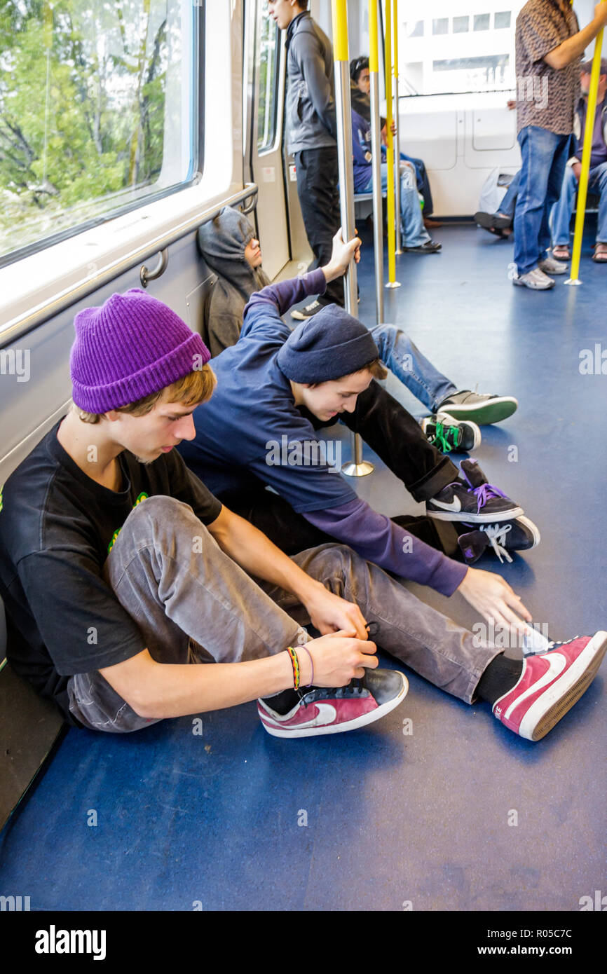 Miami Florida,Metromover,people mover system,public transportation,boy boys,male kid kids child children youngster youngsters youth youths teen teens Stock Photo