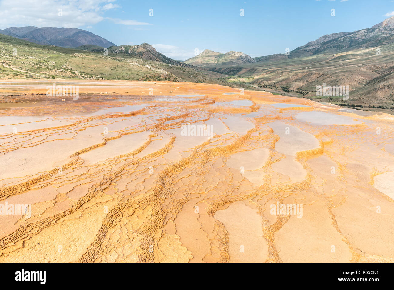 Travertine terrace at sunset near Orost, one of the rare pure travertine pools which are free accessible, Badab-e Surt, Iran Stock Photo