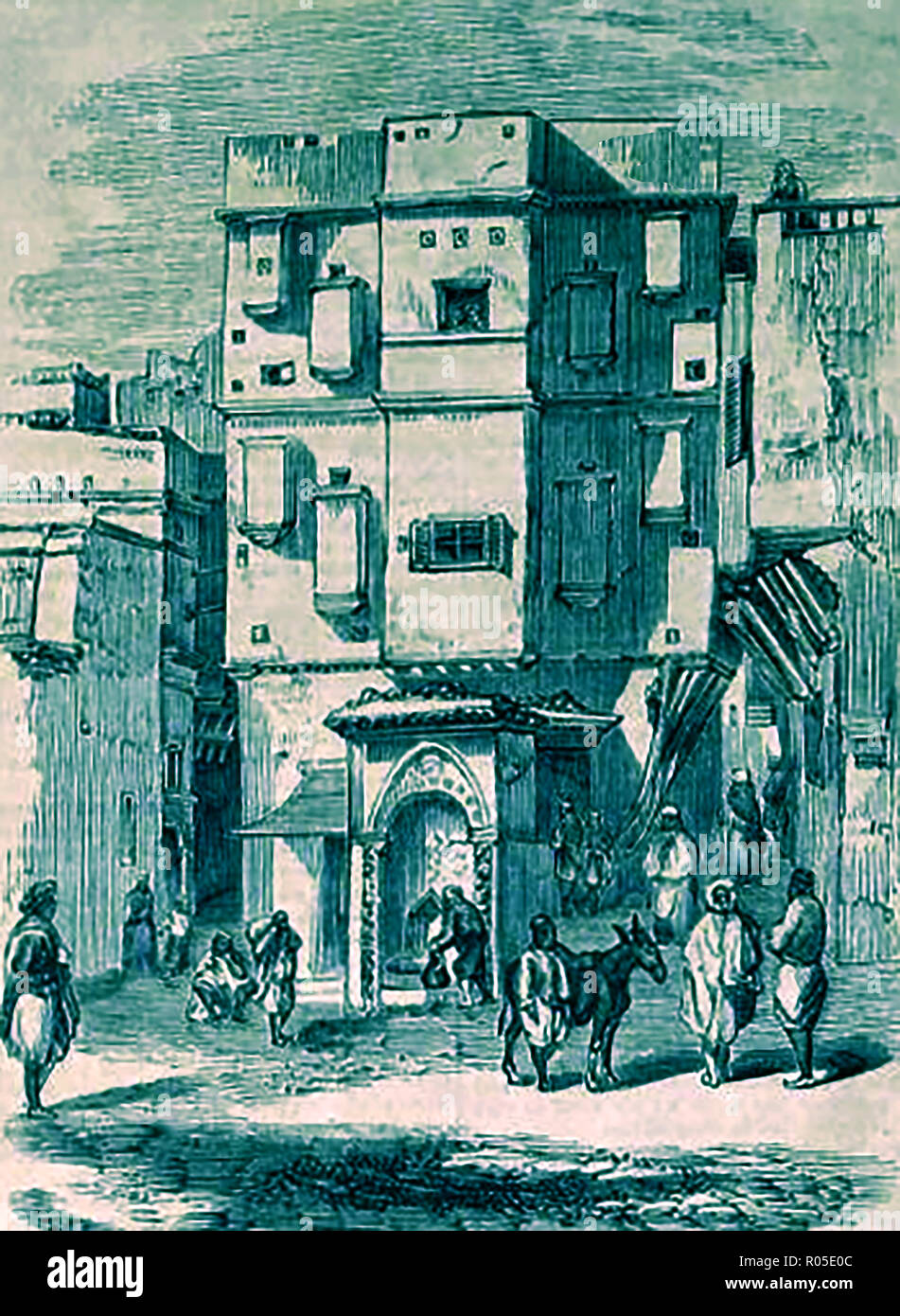1859 - A view of a street fountain in a small square in Algiers Stock Photo