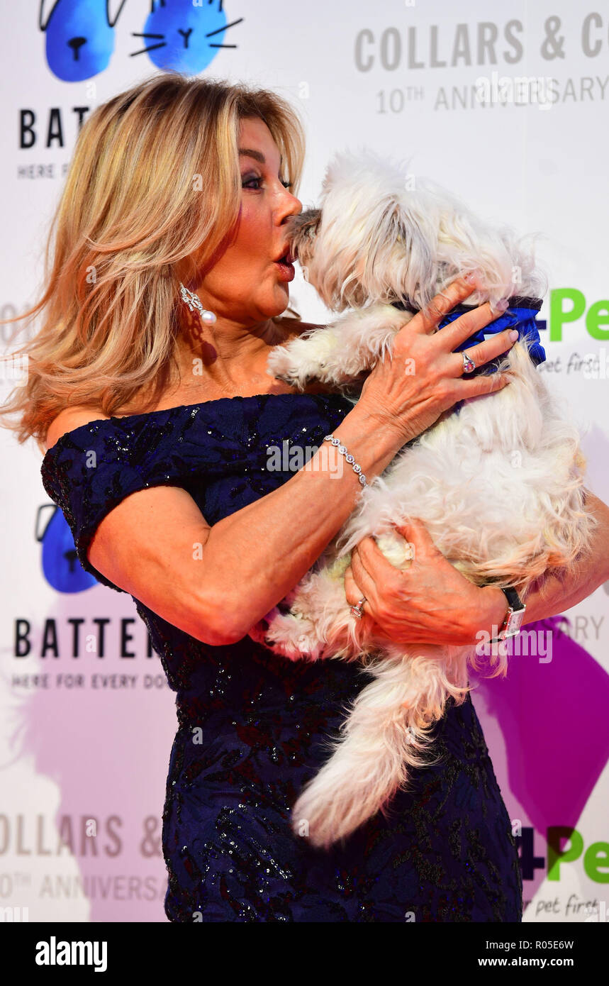 Former page three girl Jilly Johnson gets kissed by a dog as she arrives for the Battersea Dogs &amp; Cats Home Collars &amp; Coats Gala Ball 2018 at the Battersea Evolution, London. Stock Photo