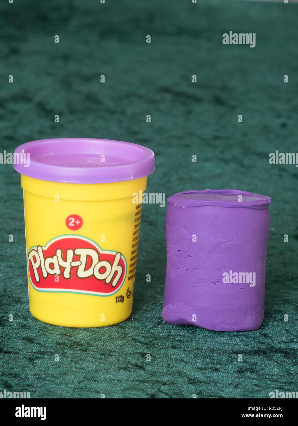 An opened plastic Play Doh container on a table Stock Photo - Alamy