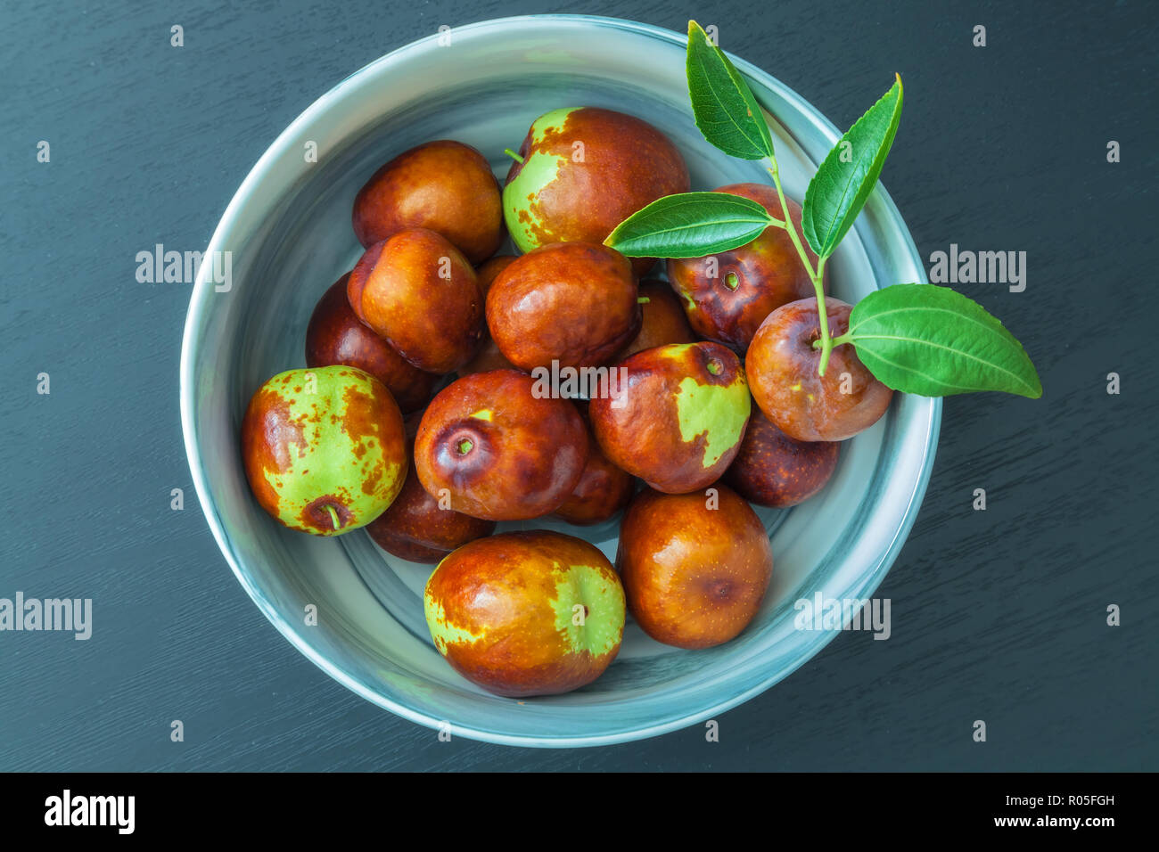 Bowl of fresh jujube fruit (Ziziphus jujuba) Stock Photo