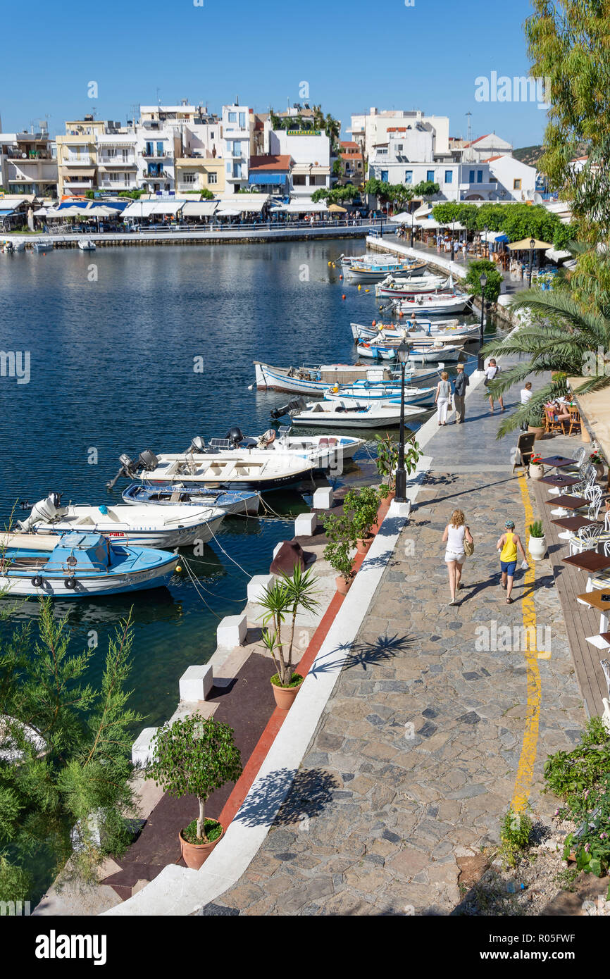 View of town and harbour, Agios Nikolaos, Lasithi Region, Crete (Kriti), Greece Stock Photo