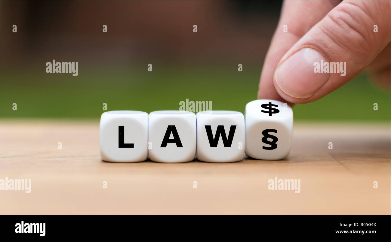 Letters on dice form the word 'LAW' Stock Photo