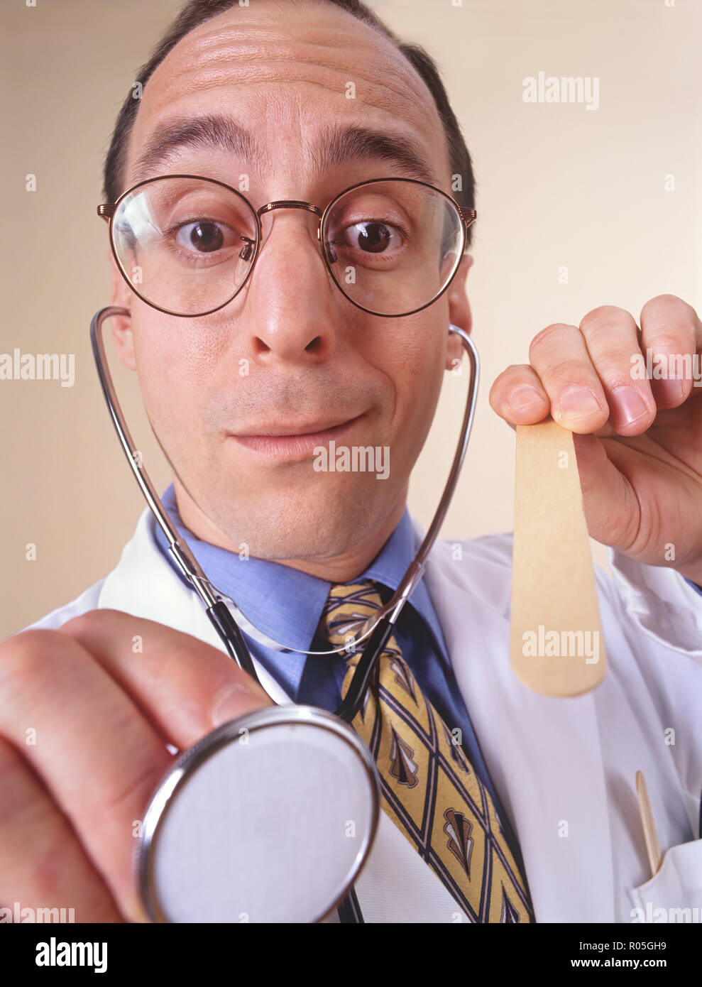 A doctors visit from a patient's personal perspective or view and doctor looking into patients mouth Stock Photo