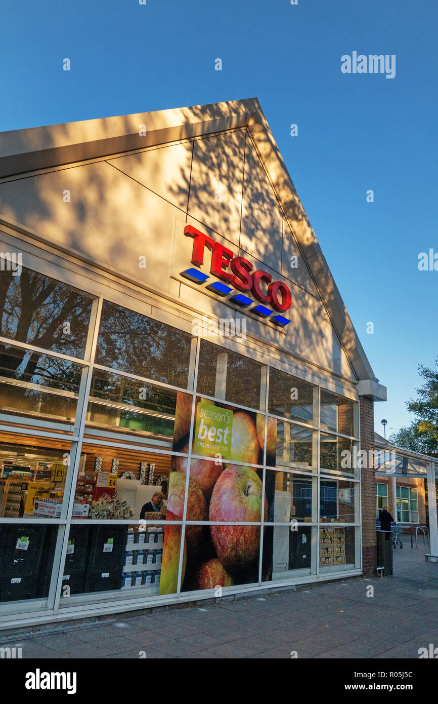 shop fronts of Friendly competition with Takeaway foods in the tiny village of Bramley, near Rotherham, South Yorkshire.Exterior of Tesco  brand name Stock Photo