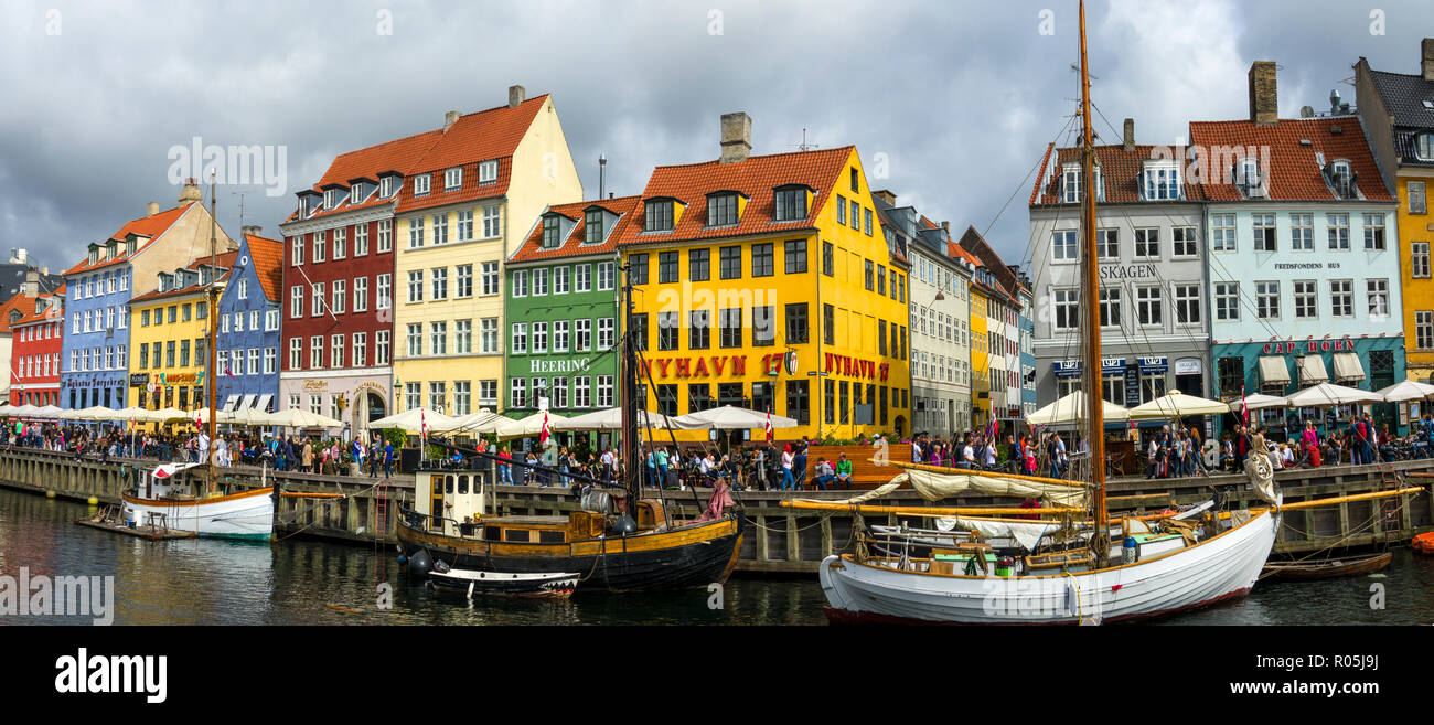 Nyhavn Copenhagen Cafes bars restaurants on the historic Nyhavn canal district Copenhagen Denmark capital city Stock Photo