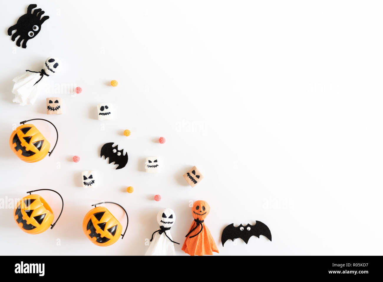 Top view of white and yellow ghost pumpkins with bat spider mummy jelly ...