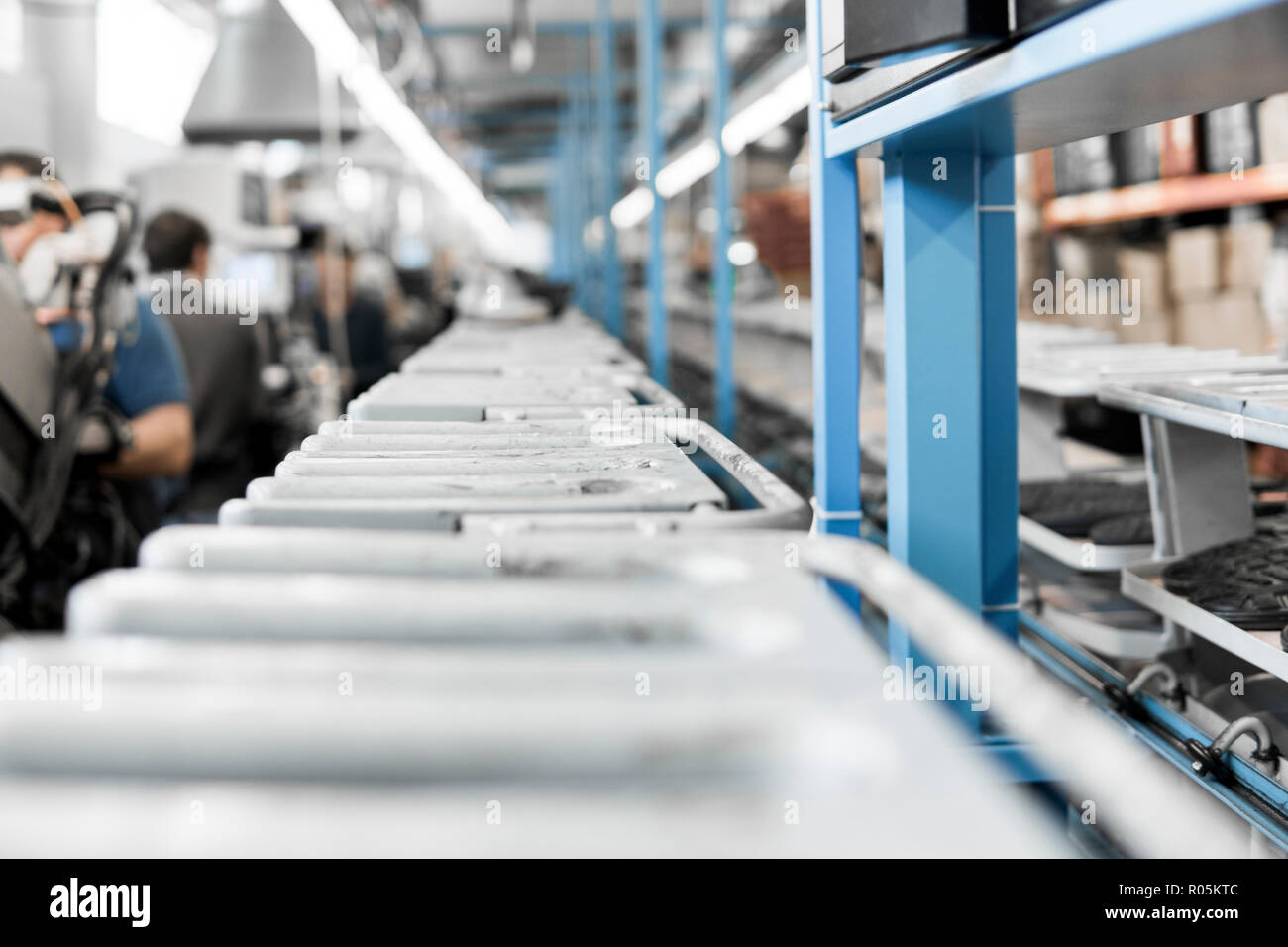 The conveyor on a shoes factory with shoe and sole. Mass production of