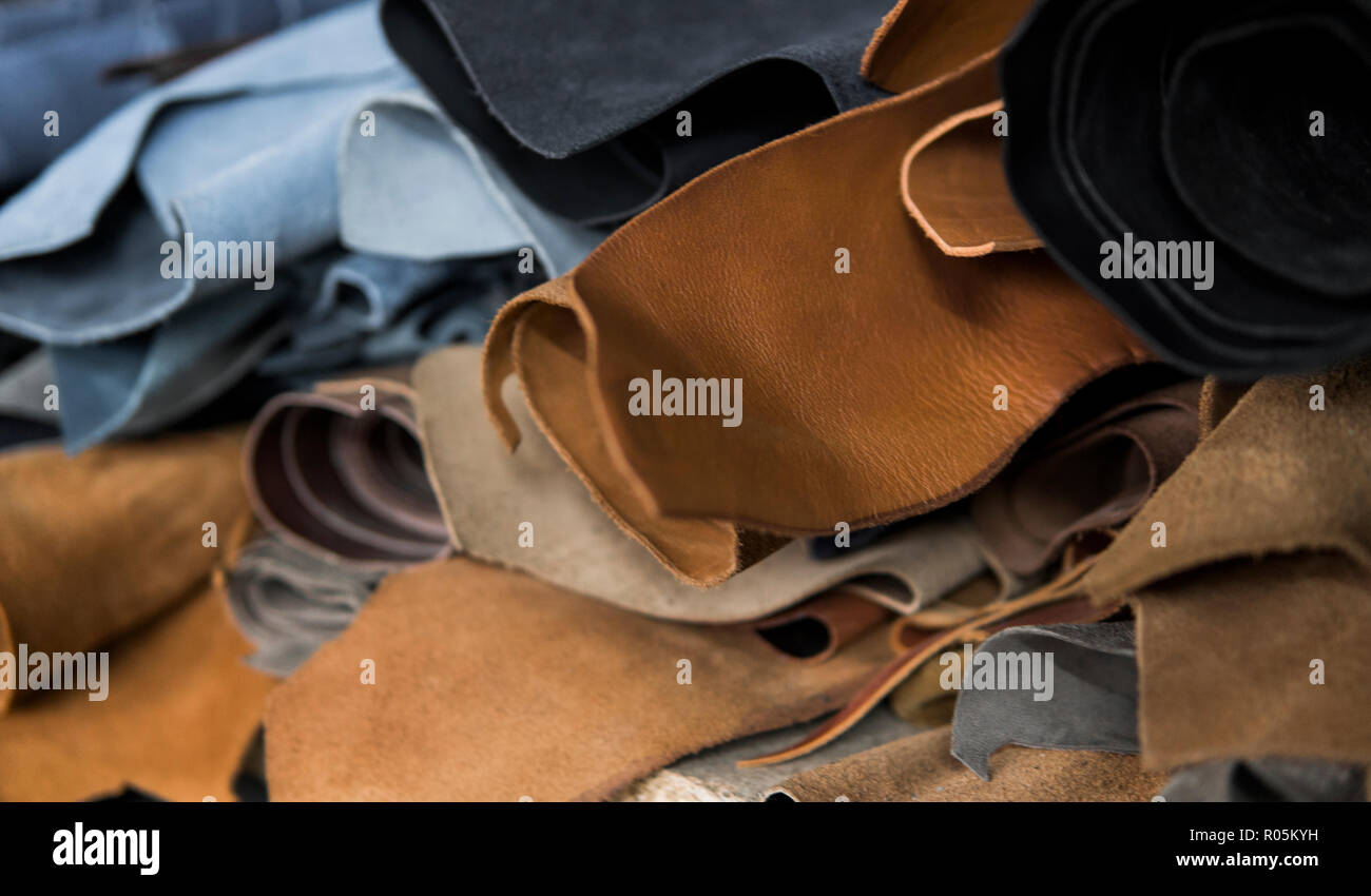 Different pieces of leather in a rolls. The pieces of the colored