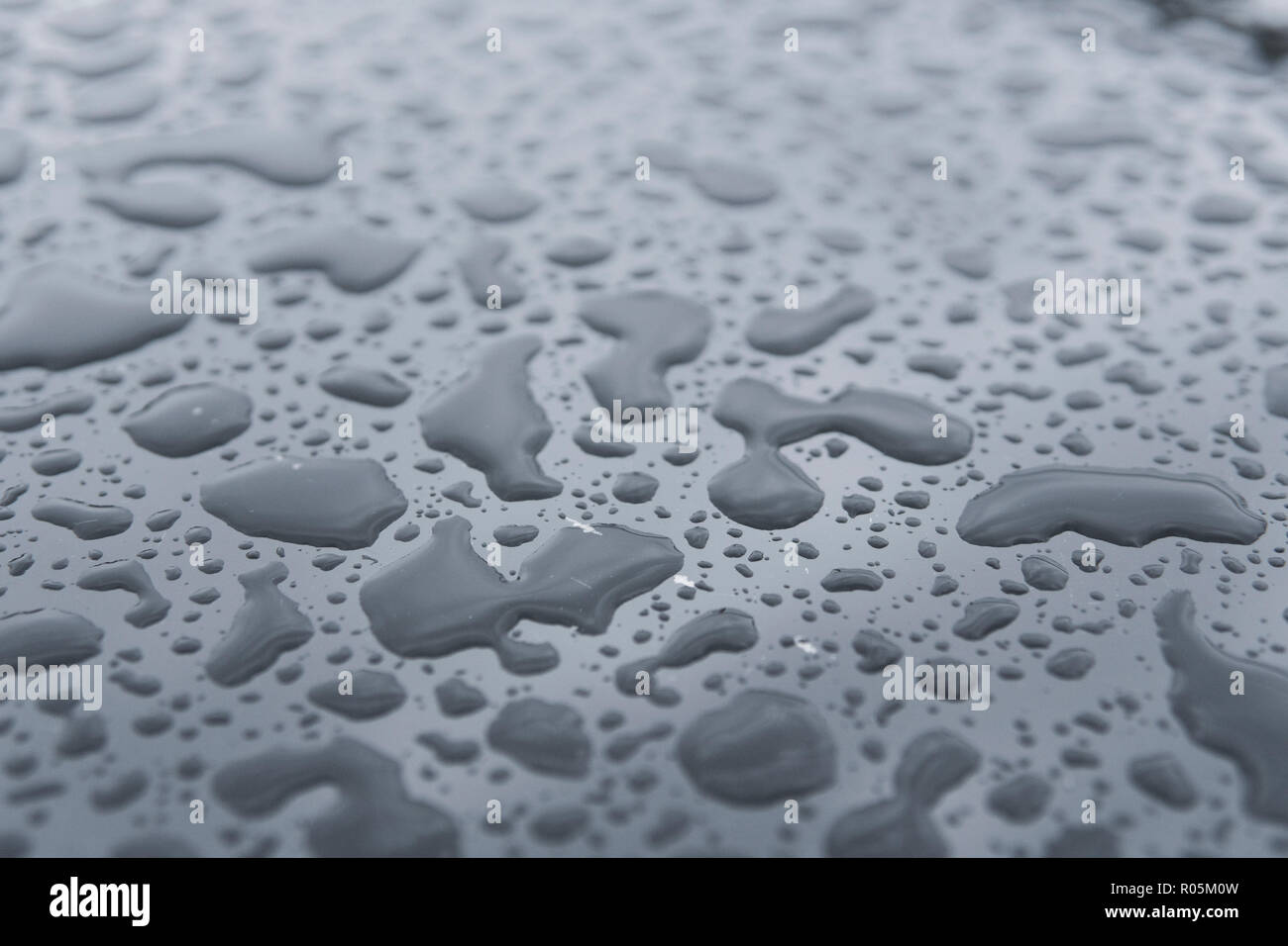 Natural water drops on a glass table after rain Stock Photo - Alamy