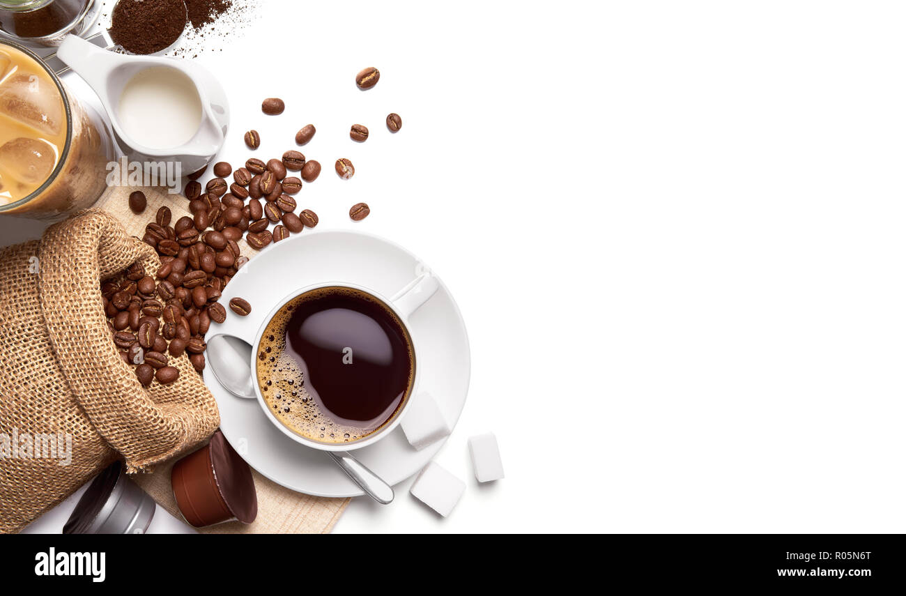 Cup of hot coffee and other ingredients over white background Stock Photo