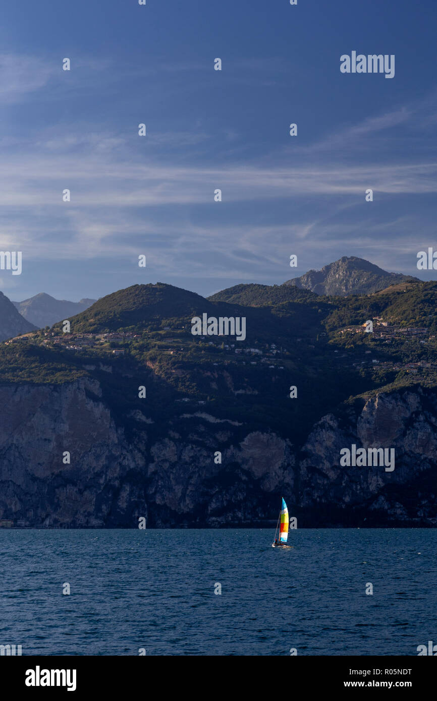 Sailboat on Lake Garda at Malcesini in northern Italy Stock Photo