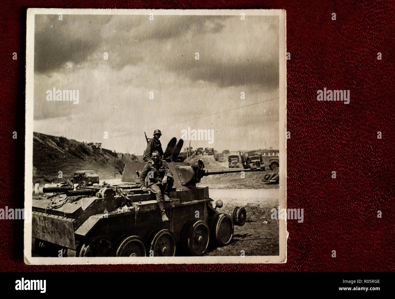 German soldiers pose for a padded tank of 52 brigades of the Red Army, Ukraine, July 1, 1941. Photo from a family photo album bought at a flea market. Stock Photo