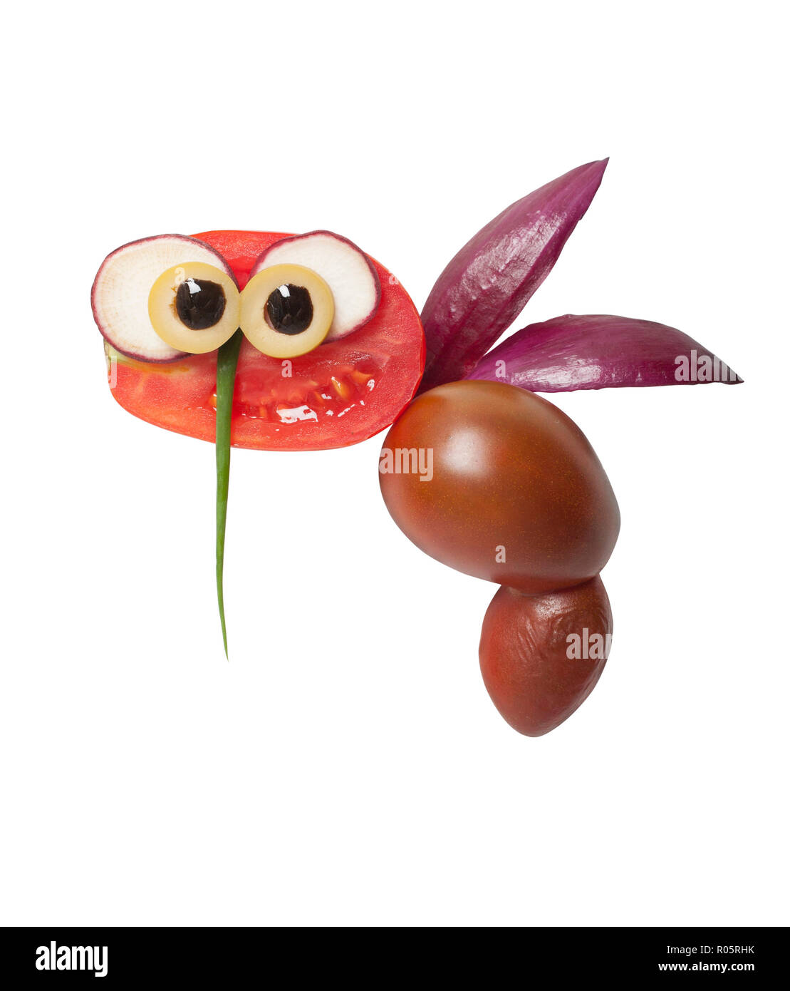 Funny bee made of tomatoes on white background Stock Photo