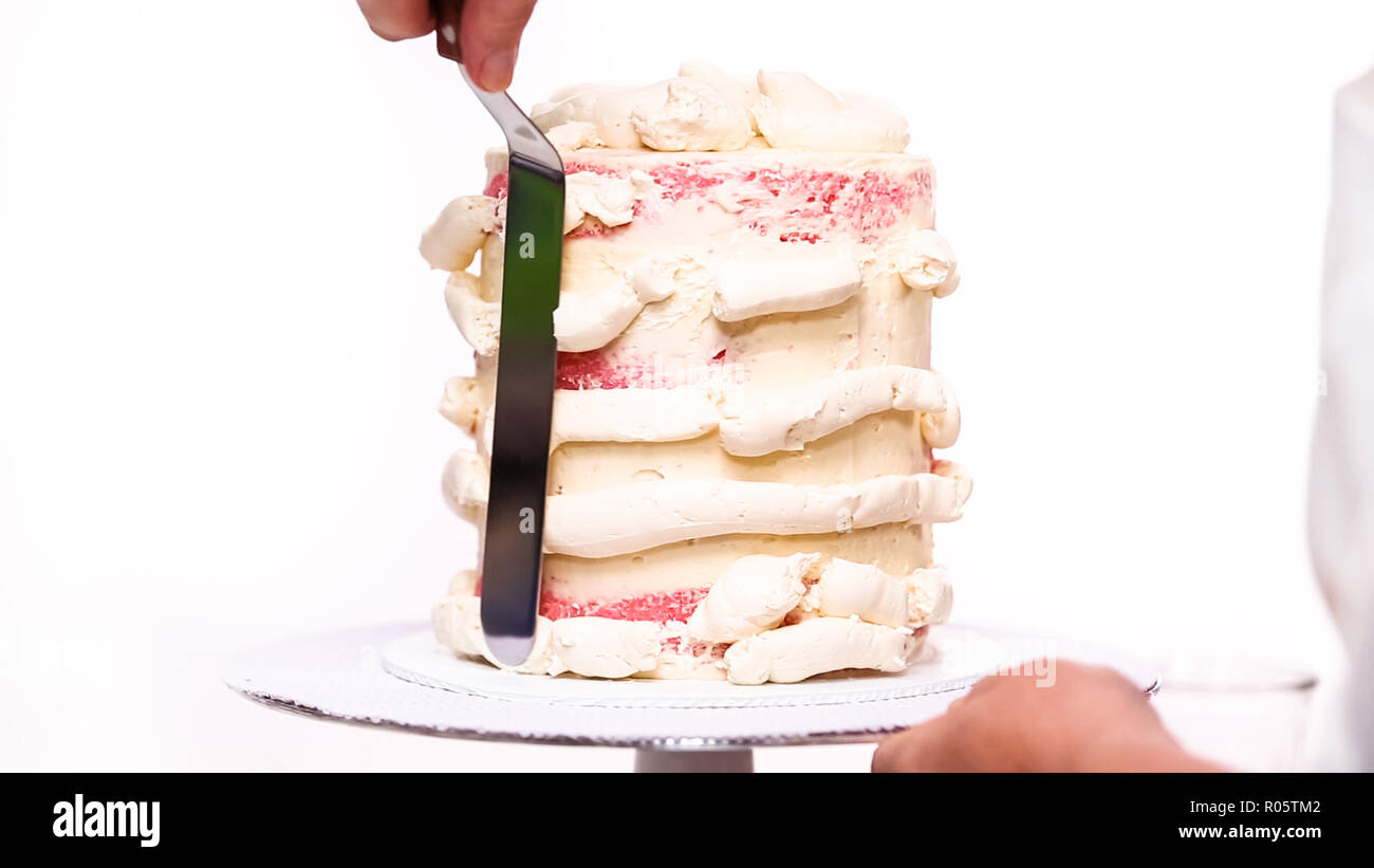 Step by step. Icing tall birthday cake with white buttercream icing