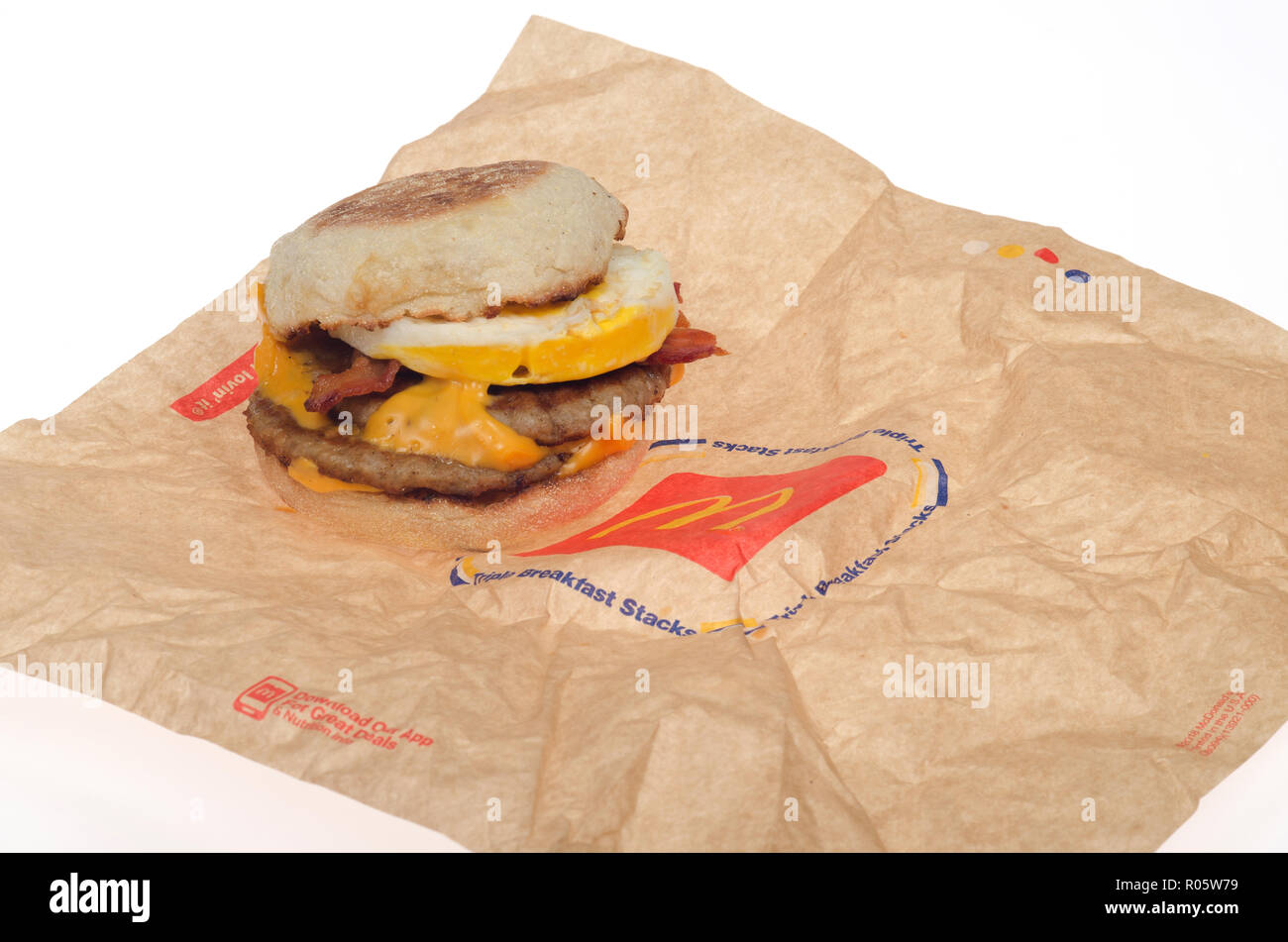 McDonald's new breakfast sandwich, the Triple Stack with 2 sausage patties, 2 slices american cheese, 2 strips of bacon, an egg on an english muffin Stock Photo